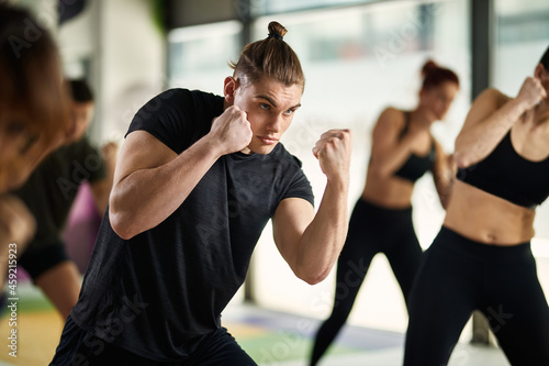Young athletic man has martial arts sports training at health club.