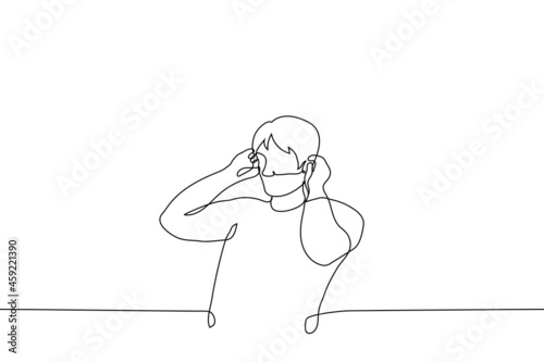 man is standing covering his own ears - one line drawing vector. man tuck his hair behind his ears; man shakes abs, upper torso