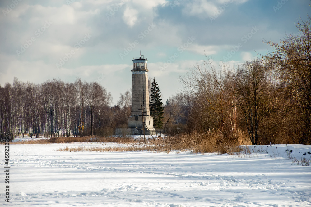 A view on a winter day at Big Volzhsky lighthouse on the river. Dubna city, Moscow region, Russia.