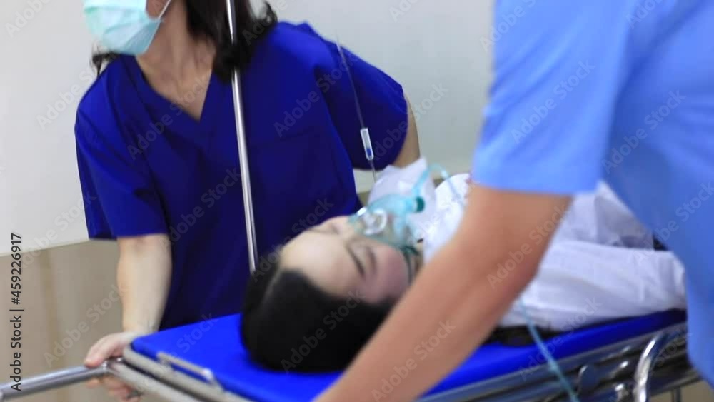 Group of Asian doctors and nurses team wearing face mask, push ...