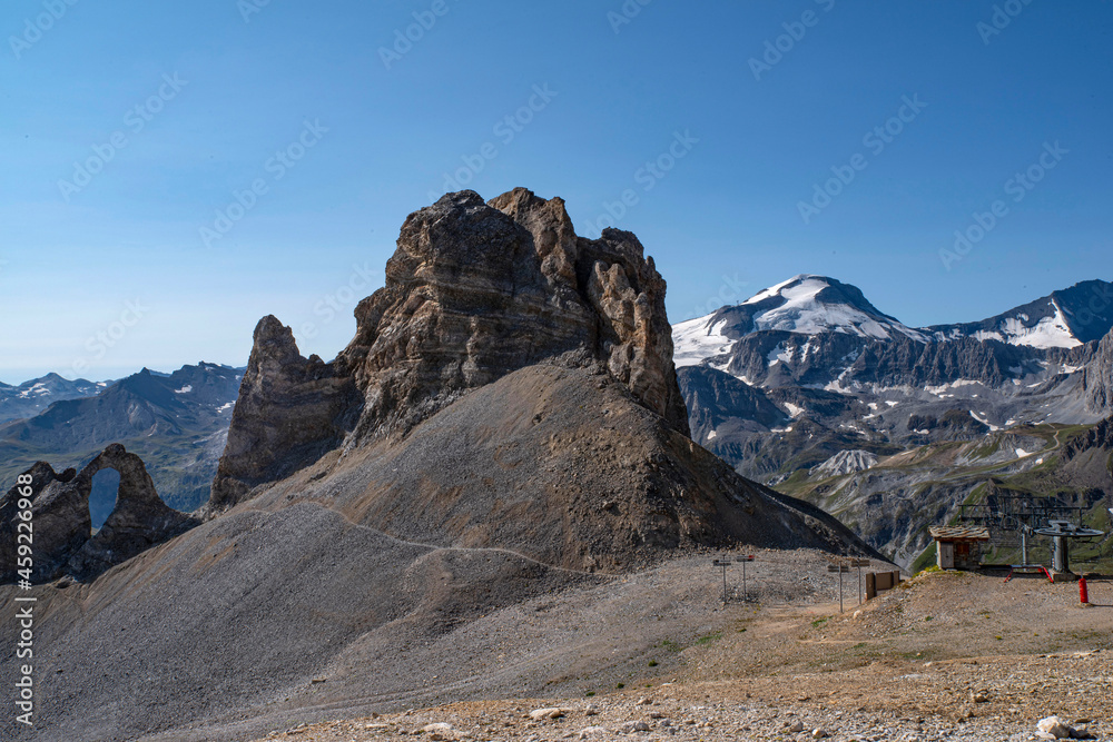 Fototapeta premium Mountain landscape with a rock arch in summer in the French Alps à Tignes