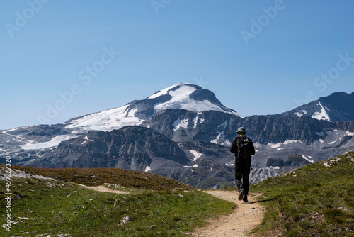 Mountain landscape in summer in the Alps in France with a hiker