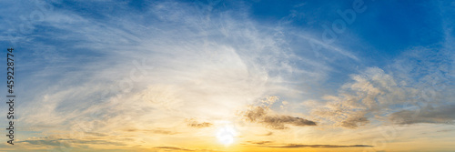 Bright sunrise on cloudy sky panoramic view background