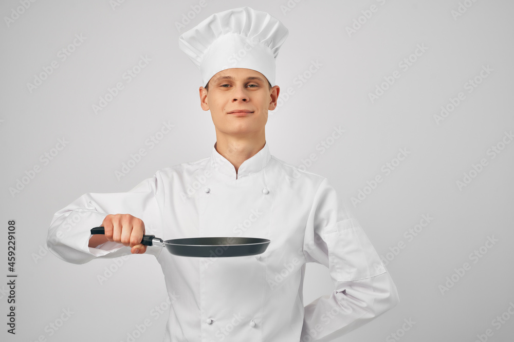 chef with a frying pan in hand kitchen service staff chef with a frying pan in hand kitchen service staff