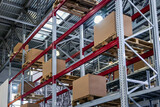 Retail Warehouse full of Shelves with Goods in Cardboard Boxes