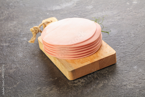 Photos Sliced pork sausages stack over board