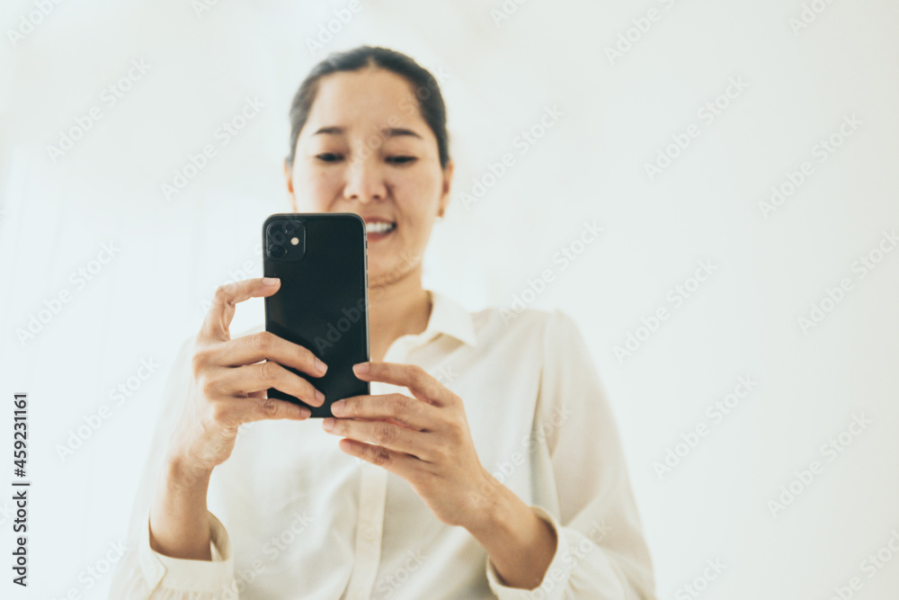 using cell phone hand holding mobile texting message contact us.chatting,search internet information in office.technology device communication connecting using cell phone hand holding mobile texting message contact us.chatting,search internet information in office.technology device communication connecting
