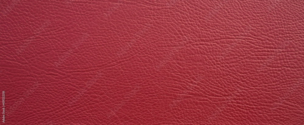 Red rectangular texture of genuine leather. Leather background in the form of a banner. A clean place for text. Red rectangular texture of genuine leather. Leather background in the form of a banner. A clean place for text.