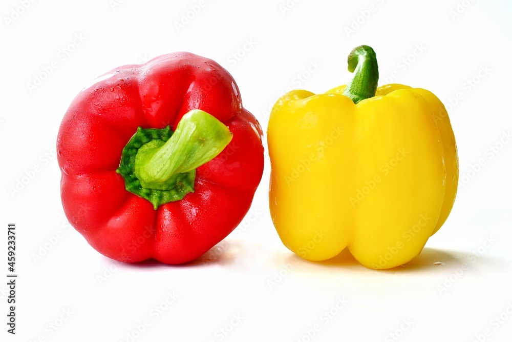 red and yellow peppers isolated on white red and yellow peppers isolated on white