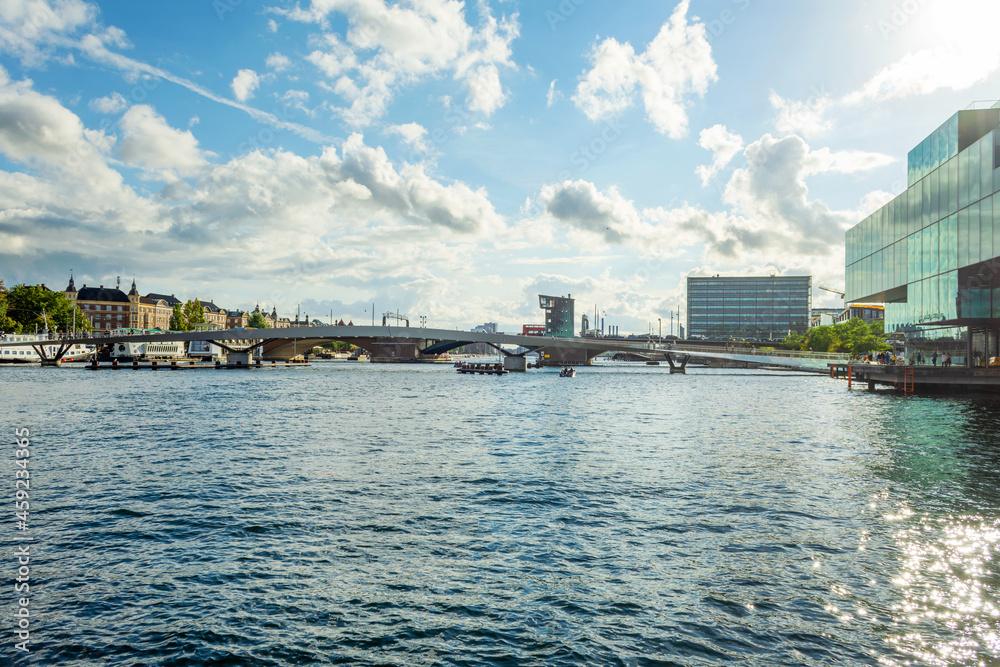 Beautiful modern buildings, and bridges on the bank of the canal in Copenhagen, Denmark.Sun, beautiful clouds. Contemporary European architecture. Architecture. Beautiful modern buildings, and bridges on the bank of the canal in Copenhagen, Denmark.Sun, beautiful clouds. Contemporary European architecture. Architecture.