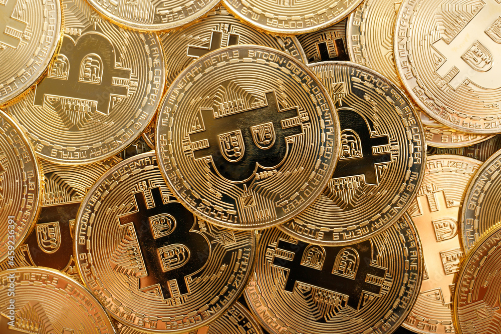 Close up shot of Bitcoin coins on black background,  A pile of Bitcoin Cryptocurrency Gold Bitcoin BTC Bit Coin.  Digital blockchain technology, bitcoin mining concept