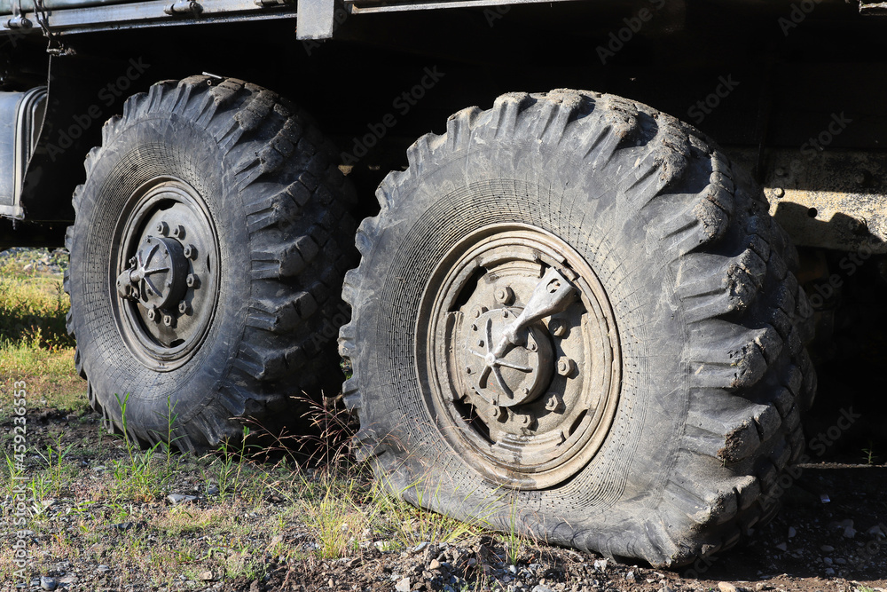 A flat tire of the off-road vehicle Ural-4320, closeup