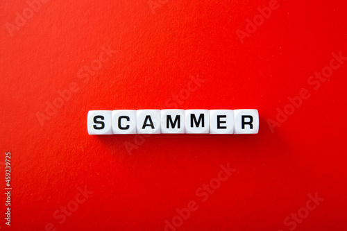 White block with scammer word photo