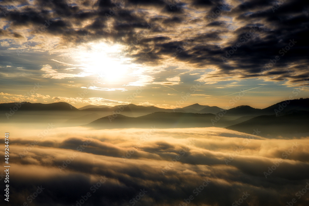 Sunset over fog in the mountains
