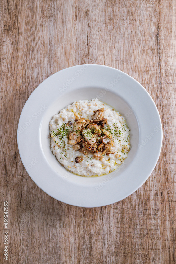 Mushroom risotto in a white bowl