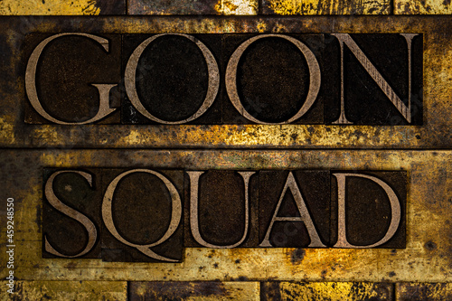 Goon Squad text on textured grunge copper and vintage gold background