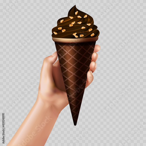 The hand holding chocolate ice cream cone with nuts