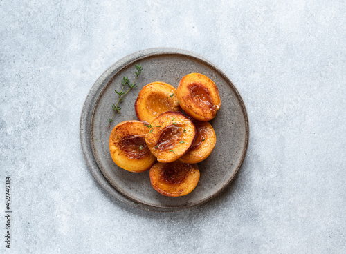 Fototapeta Naklejka Na Ścianę i Meble -  Baked peaches with honey and cinnamon