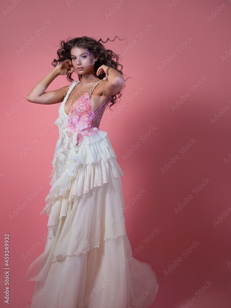 A beautiful young brunette with long curls in a fabulous image, A beautiful young brunette with long curls in a fabulous image,