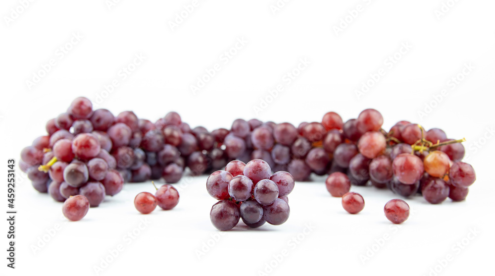 Grapes. Purple seedless grapes. Isolated fruit background on a white background. Grapes. Purple seedless grapes. Isolated fruit background on a white background.