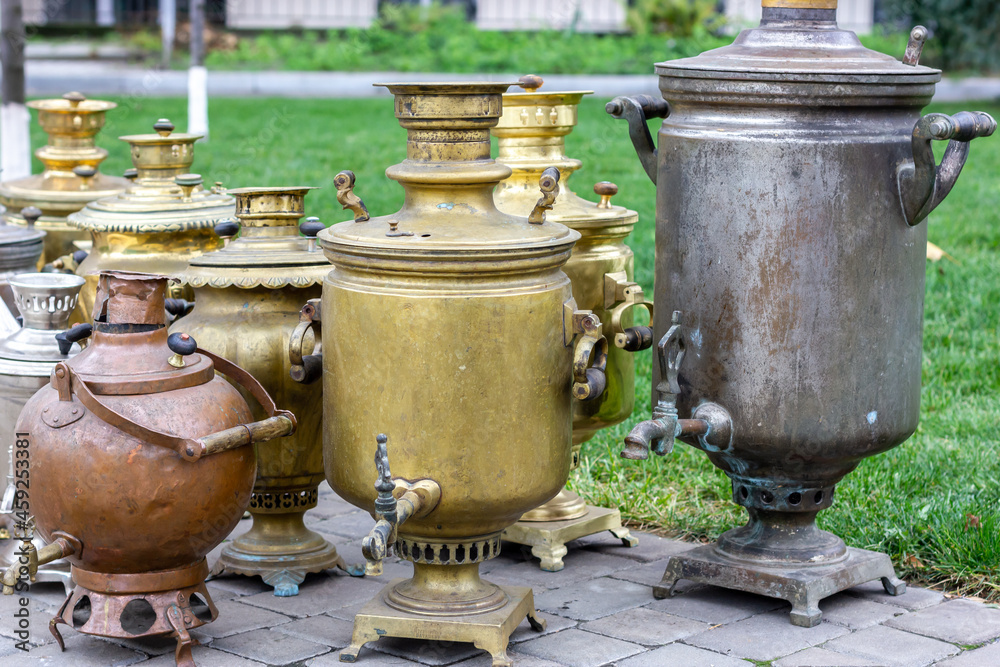 Exhibition of old-fashioned iron samovars. Bronze samovar. Exhibition of old-fashioned iron samovars. Bronze samovar.