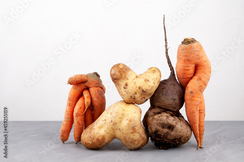 Ugly vegetables, close-up. Concept - Using in cooking imperfect products. Food organic waste reduction photo