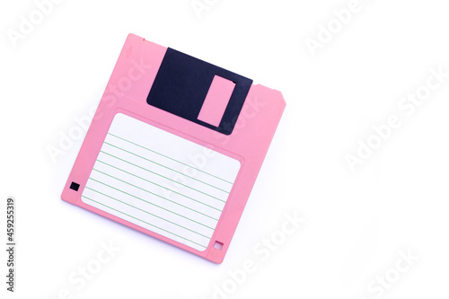 Pink floppy disk on white background 