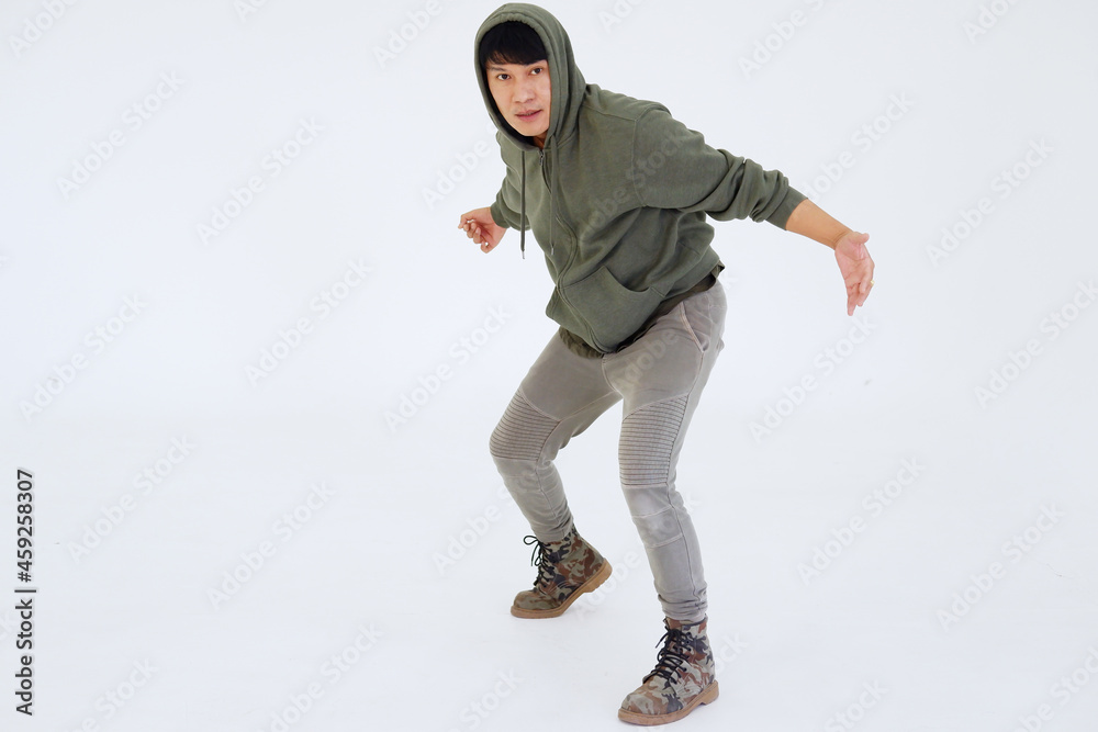 Smiling Asian young professional dancer man is break dancing by one leg and arm isolataed on white background in studio. Education and sport for hobbies concept. Smiling Asian young professional dancer man is break dancing by one leg and arm isolataed on white background in studio. Education and sport for hobbies concept.