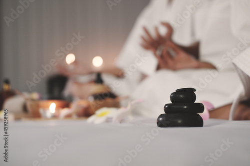 Photography Closed up on black stone and hand women for yoga meditation for create concentra