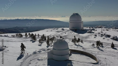 Aerial footage of snowy astronomical observatory in Calar Alto after snowfall , Sierra de los Filabres, Almeria, Spain