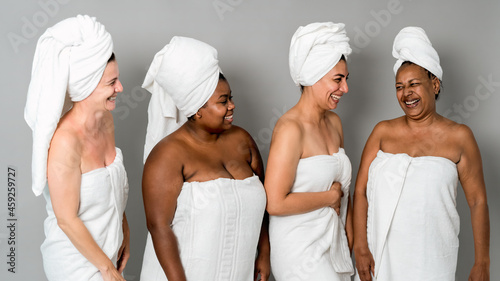 Happy females with different age and body size having skin care spa day - People wellness and selfcare concept