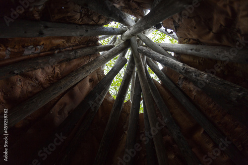Low angle view of the inside of a wood and birch bark traditional native tipi, Gaspé, Quebec, Canada photo