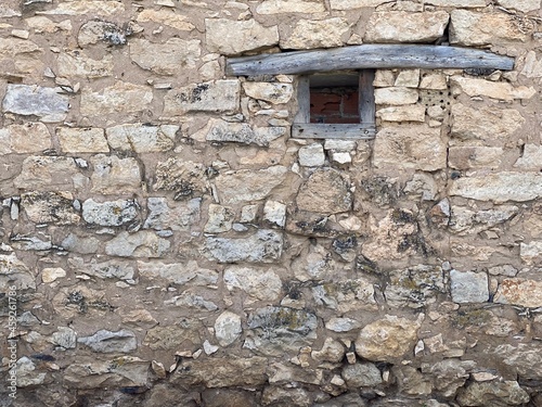 Old window on background in a village.