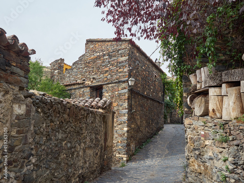 Photography of traditional slate houses in the streets of Patones de Arriba, a touristic mountain village in the province of Madrid. Spain. Europe