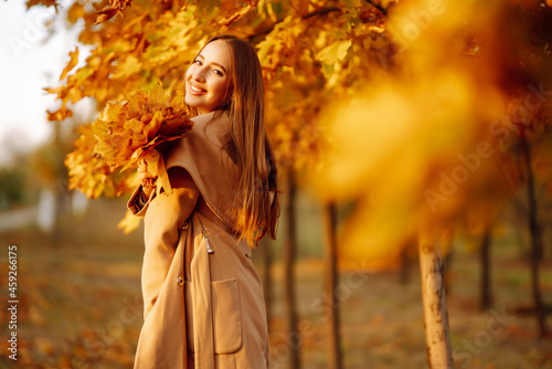 Young woman resting in nature. People, relaxation and vacations concept. Autumn style.