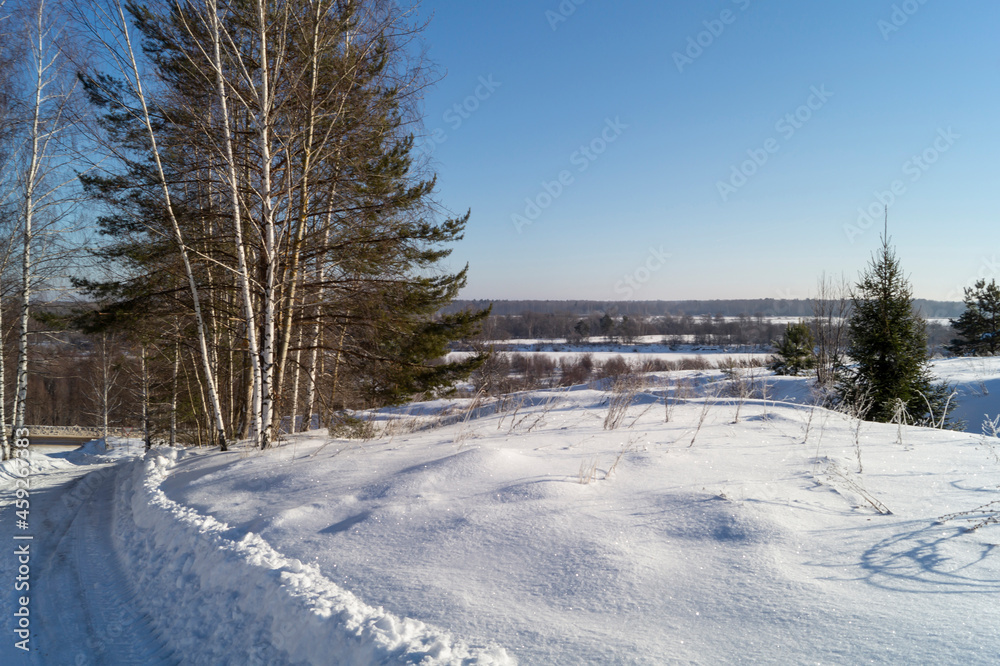 The Winter landscape with expensive in wood at solar day.