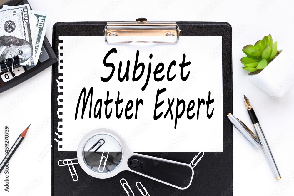 Business Acronym SME as Subject Matter Expert. text on a white sheet of paper near a magnifying glass m flowerpot in a pot