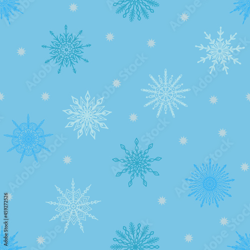Seamless pattern with hand drawn snowflake icons on light blue backdrop. Winter Christmas festive background, snow texture