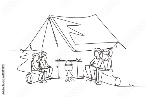 Continuous one line drawing hiking family around campfire tents boil water in pot. Parent and kid getting warm near bonfire and sitting on logs. Single line draw design vector graphic illustration