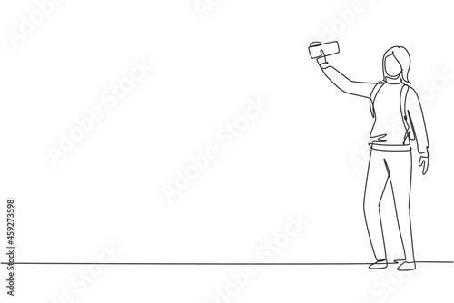 Continuous one line drawing woman making selfie with smartphone. Travel girl with backpack taking selfie. Tourism nature backpacking or trekking. Single line draw design vector graphic illustration