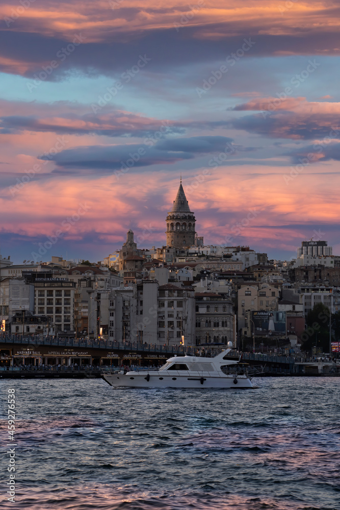 Cityscape of a part of Istanbul city showing homes and Galata tower at sunset at the Harborside Eminönü.