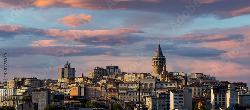 Cityscape of a part of Istanbul city showing homes and Galata tower at sunset at the Harborside Eminönü. photo