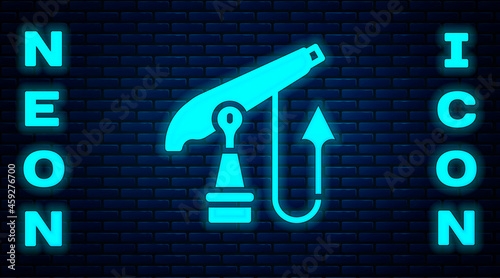 Glowing neon Fishing harpoon icon isolated on brick wall background. Fishery manufacturers for catching fish under water. Diving underwater equipment. Vector