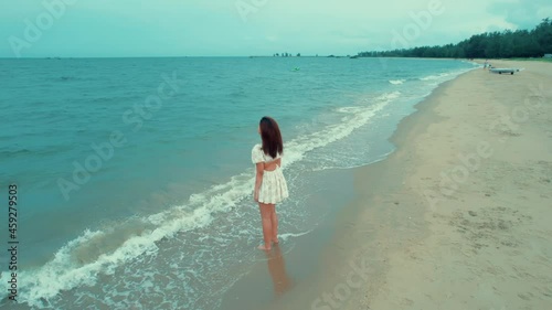 Ariel views Women walking on the beach at Hua Hin beach Thailand.