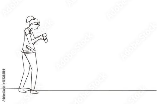 Single one line drawing woman photographers or paparazzi taking photo with digital cameras with angles. Girl Journalists or reporters checking pictures. Continuous line draw design vector illustration