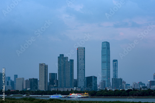 Urban skyscrapers under the rosy sky at nightfall 