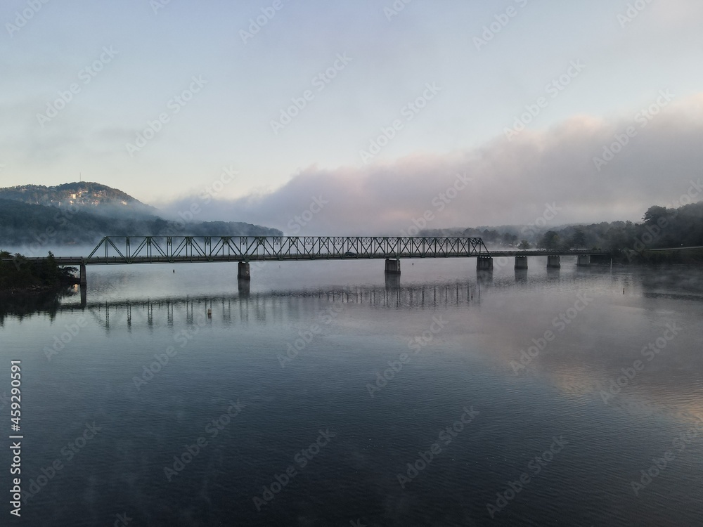 A bridge over water with a foggy sunrise. Bridge is on Lake Allatoona in Cartersville A bridge over water with a foggy sunrise. Bridge is on Lake Allatoona in Cartersville