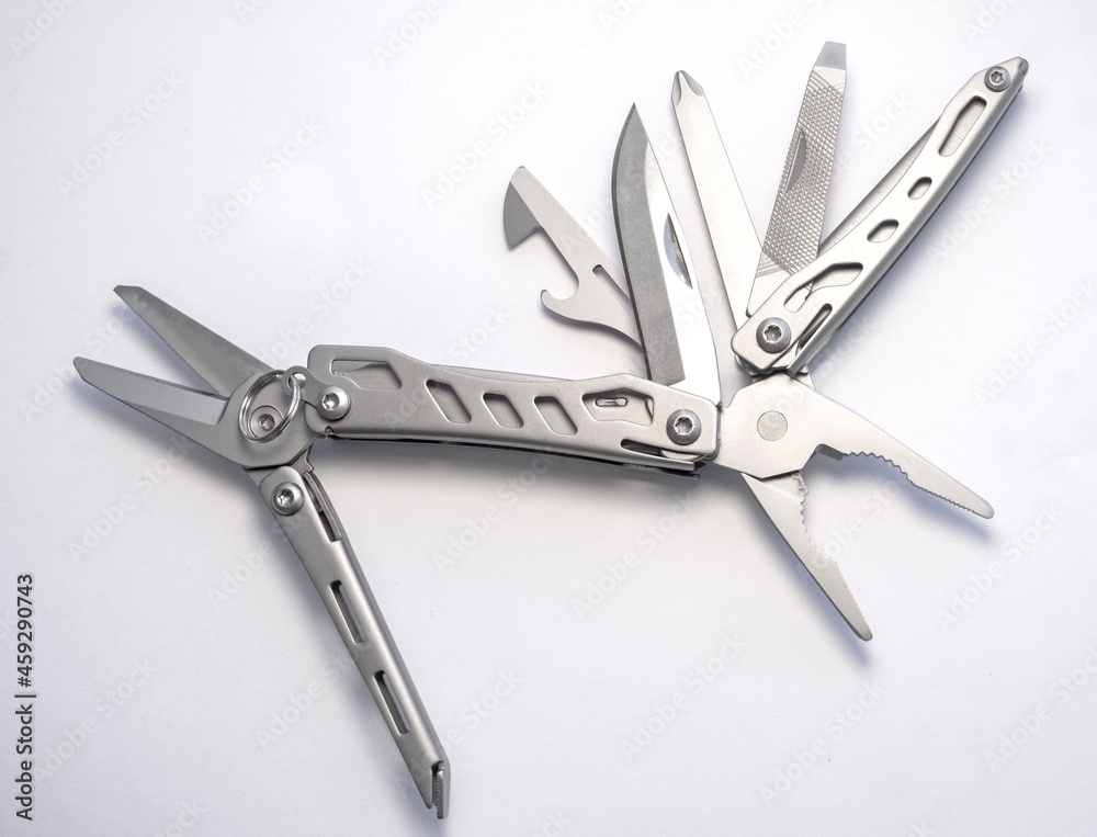 Miniature, pocket-sized universal Multi tool containing a knife, opener, pliers, scissors and file. Miniature, pocket-sized universal Multi tool containing a knife, opener, pliers, scissors and file.