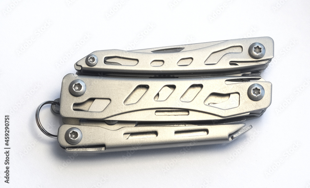 Miniature, pocket-sized universal Multi tool containing a knife, opener, pliers, scissors and file. Miniature, pocket-sized universal Multi tool containing a knife, opener, pliers, scissors and file.