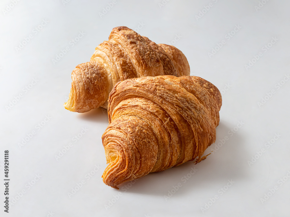 Two French croissants with a golden crust from the bakery